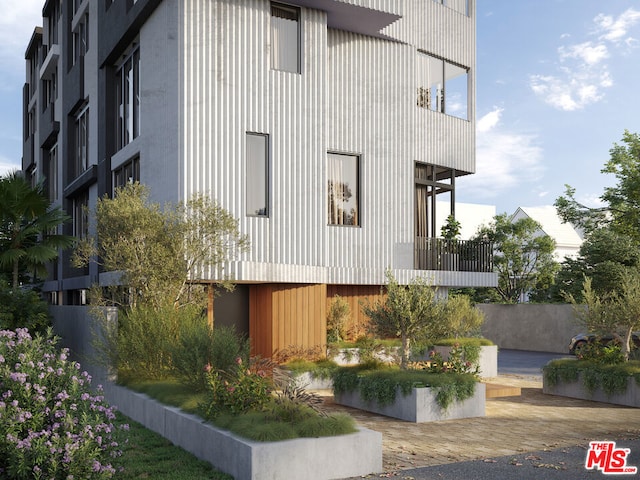 view of home's exterior with a balcony