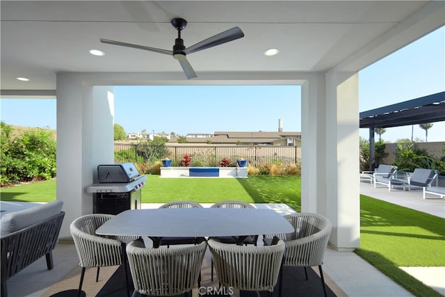 view of patio with area for grilling, outdoor lounge area, and ceiling fan