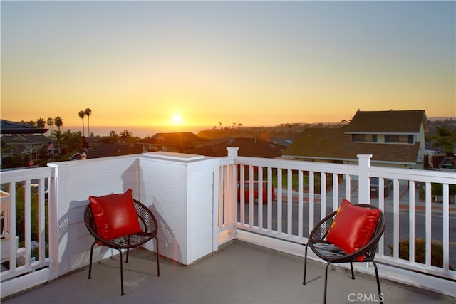 view of balcony at dusk