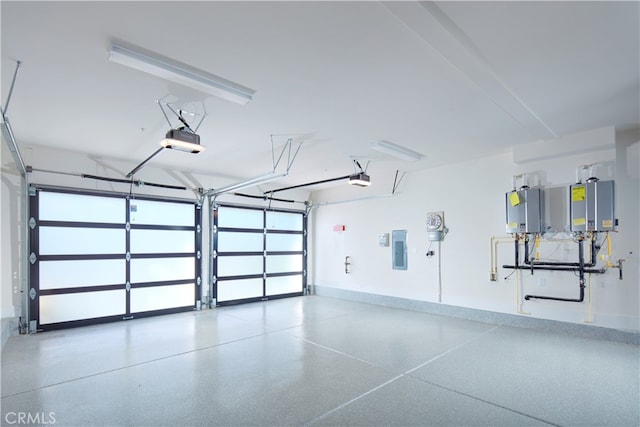 garage with a garage door opener and electric panel