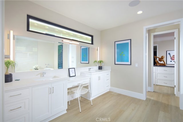 bathroom featuring wood-type flooring and vanity