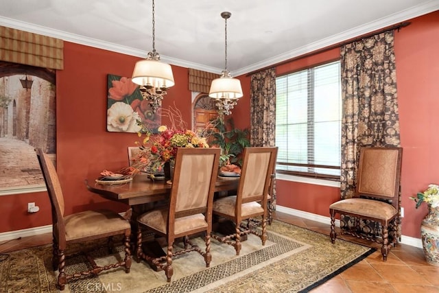 tiled dining area featuring crown molding and a wealth of natural light