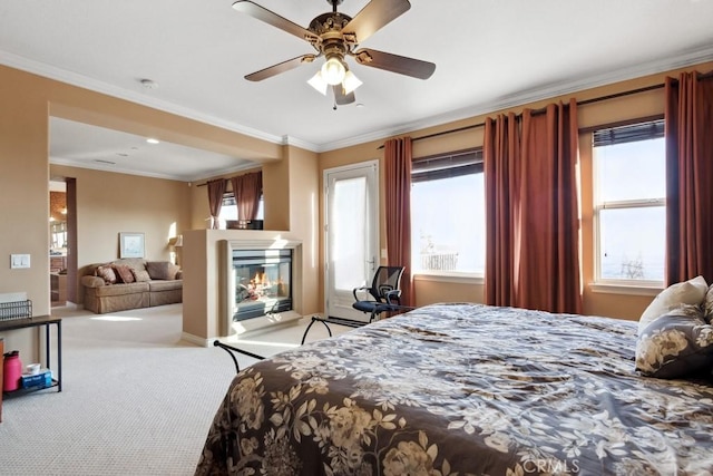 bedroom with ornamental molding, ceiling fan, and light carpet