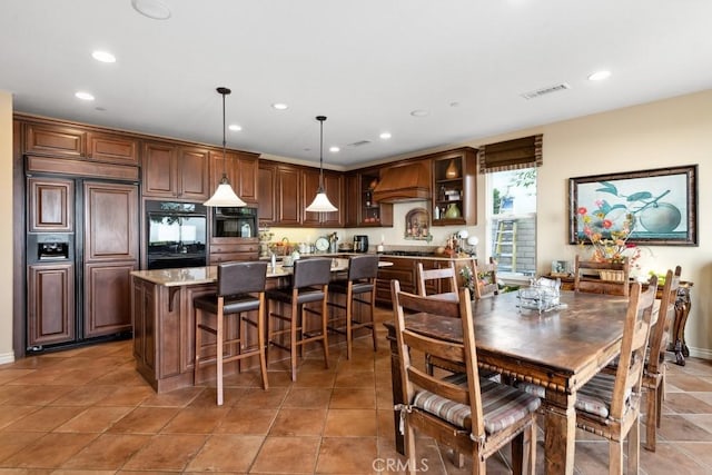 dining room with tile patterned flooring