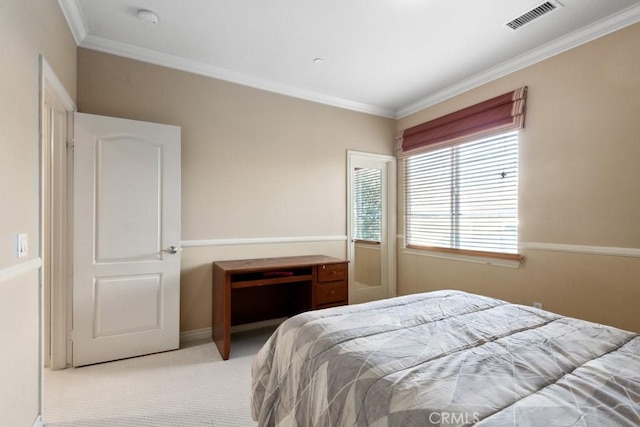 bedroom with multiple windows, crown molding, and light colored carpet