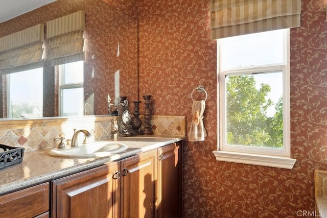 bathroom featuring vanity and plenty of natural light