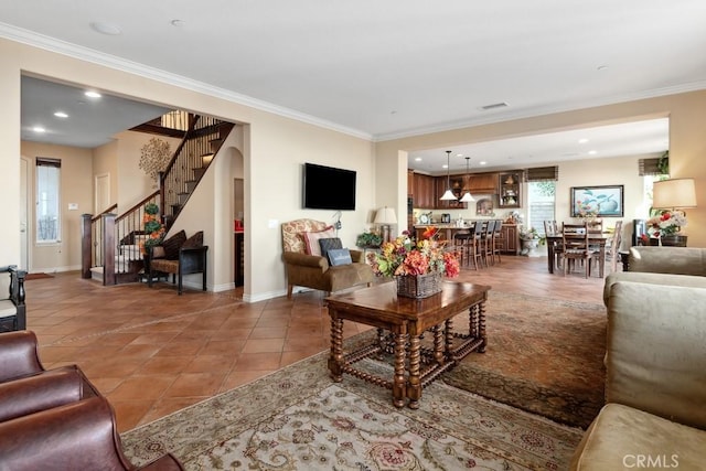 living room featuring tile patterned flooring and ornamental molding