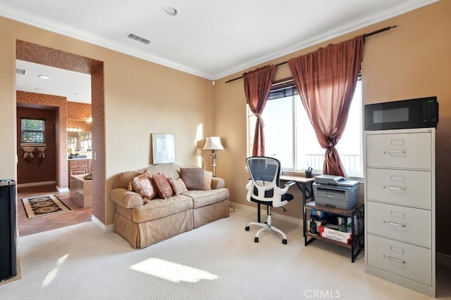 home office featuring light colored carpet and crown molding