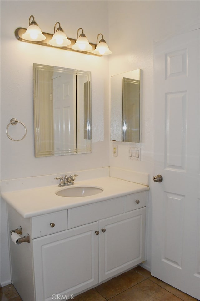 bathroom with tile patterned flooring and vanity