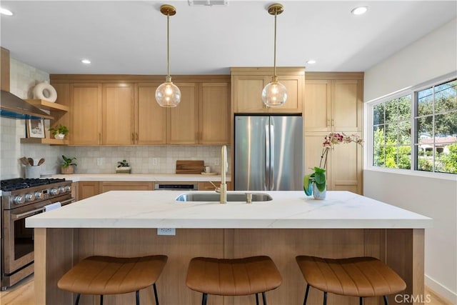 kitchen featuring a center island with sink, hanging light fixtures, backsplash, and appliances with stainless steel finishes