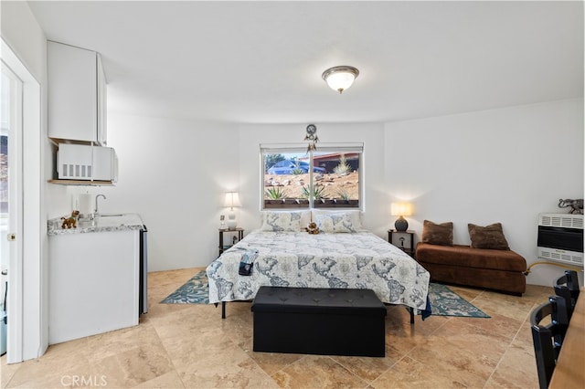 bedroom featuring heating unit