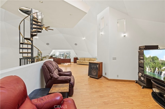 living room with light wood-type flooring and lofted ceiling