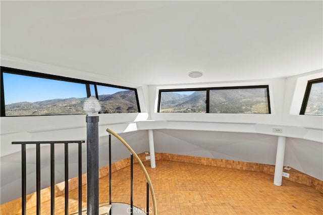 interior space featuring a mountain view and vaulted ceiling