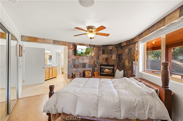 bedroom with ceiling fan and light wood-type flooring