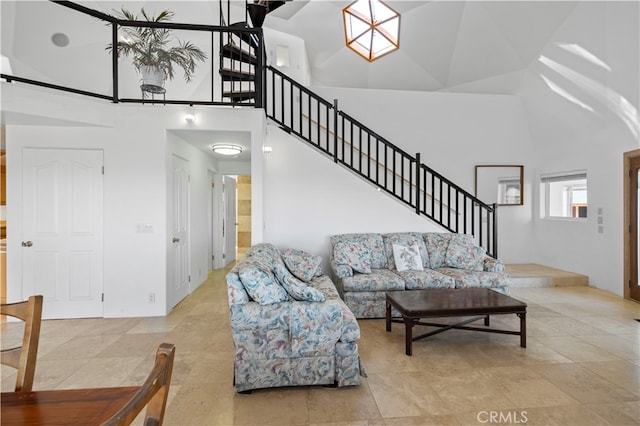 living room featuring light tile patterned flooring and high vaulted ceiling