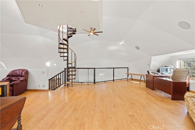 additional living space with vaulted ceiling, light hardwood / wood-style flooring, and ceiling fan