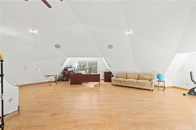 interior space with lofted ceiling, light hardwood / wood-style flooring, and ceiling fan