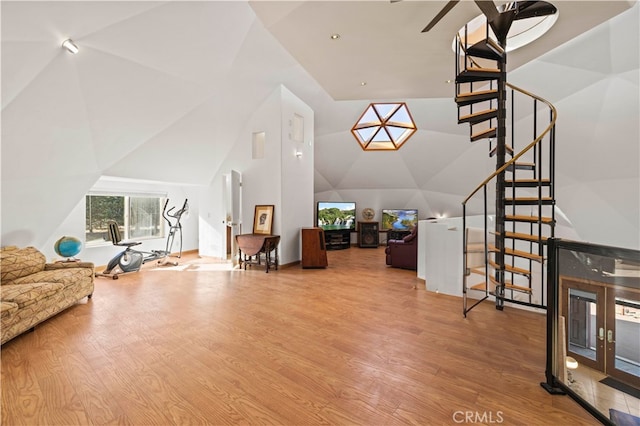 living room featuring vaulted ceiling and hardwood / wood-style flooring