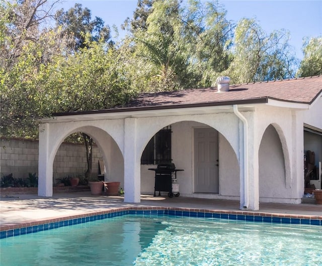 view of pool featuring a patio and area for grilling