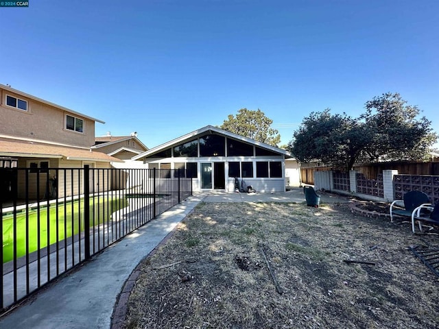 rear view of house with a yard