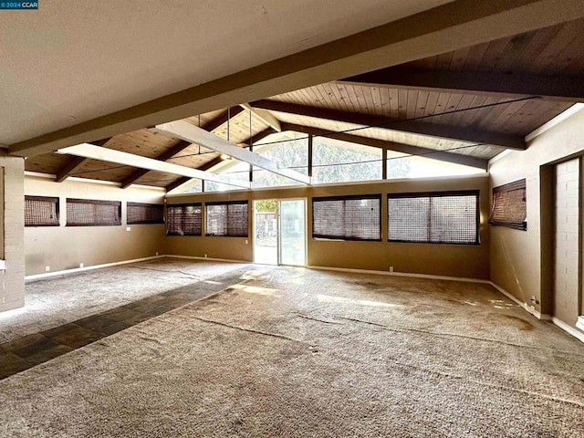 unfurnished sunroom featuring lofted ceiling with beams and wood ceiling