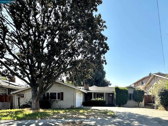 single story home with a garage