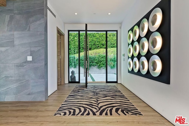 entryway with light hardwood / wood-style floors