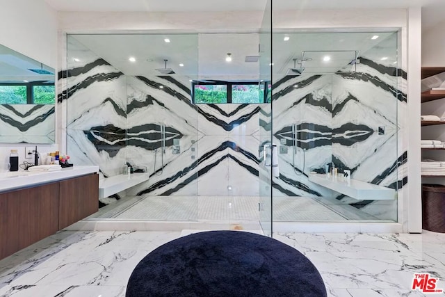 bathroom with vanity and a shower with shower door