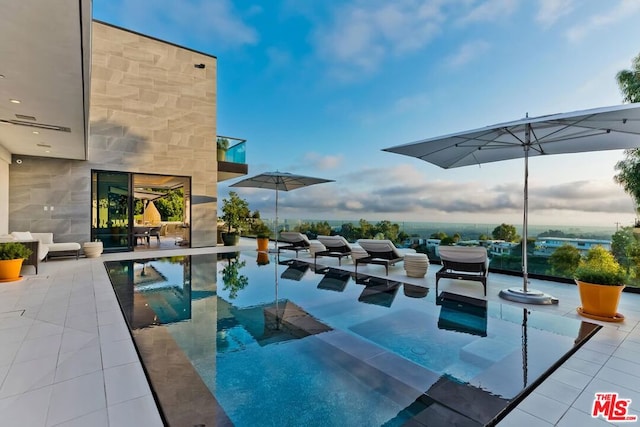 view of pool featuring a patio