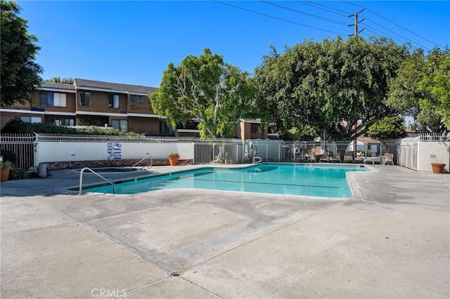 view of swimming pool featuring a patio area