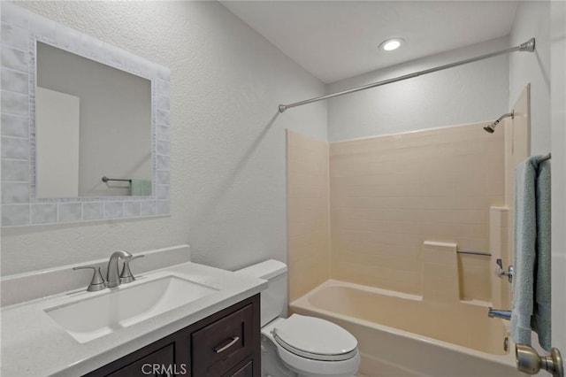 full bathroom with vanity, washtub / shower combination, and toilet