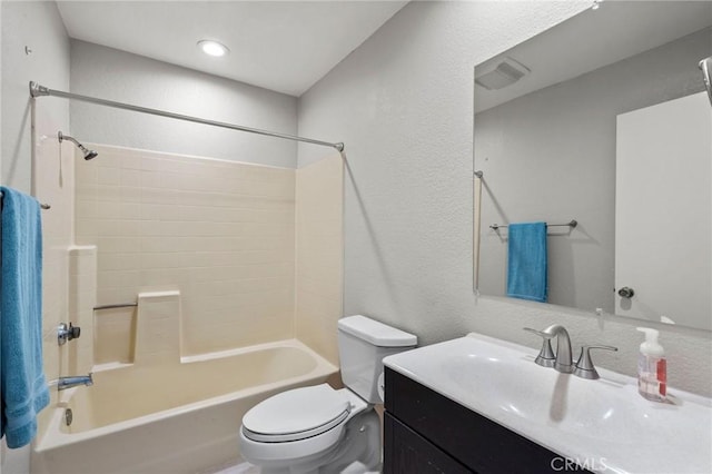 full bathroom featuring vanity, bathing tub / shower combination, and toilet