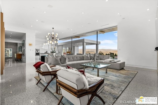 living room with a mountain view, a notable chandelier, and expansive windows