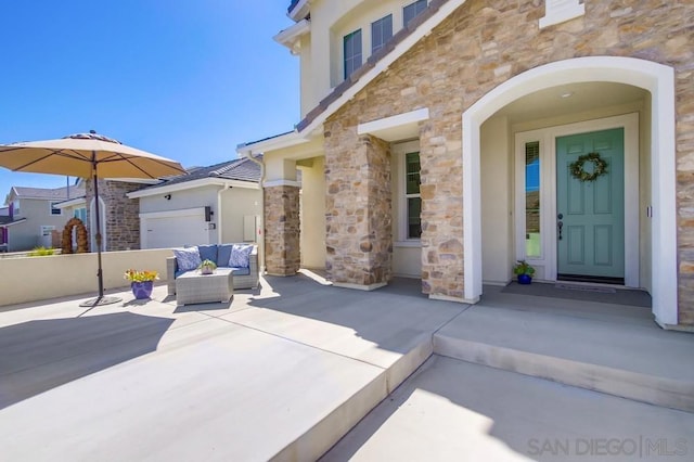 entrance to property with a patio