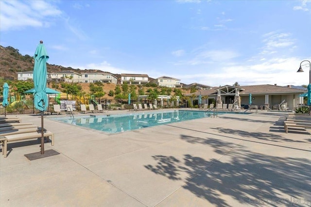 view of swimming pool featuring a patio