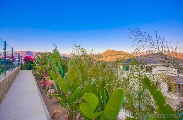 yard at dusk with a mountain view