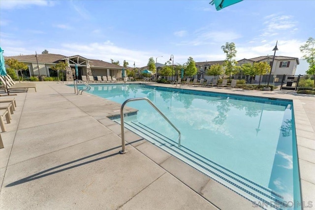 view of swimming pool with a patio