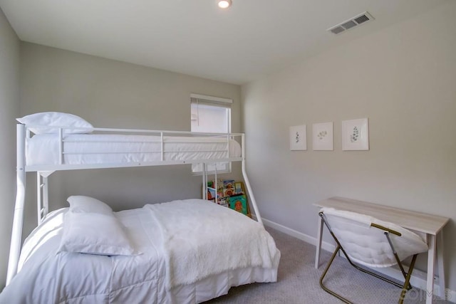 bedroom with light colored carpet