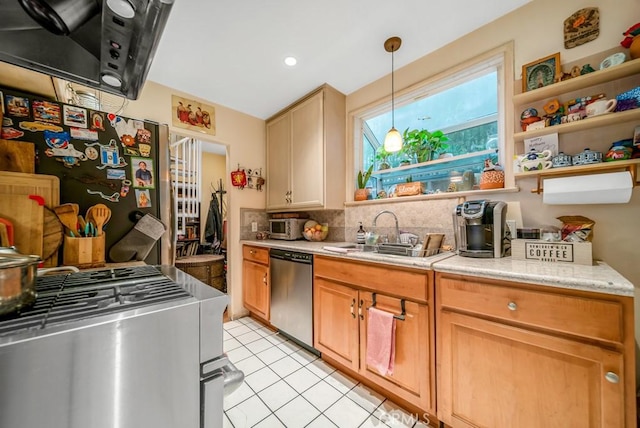 kitchen with light tile patterned flooring, sink, decorative light fixtures, stainless steel appliances, and backsplash