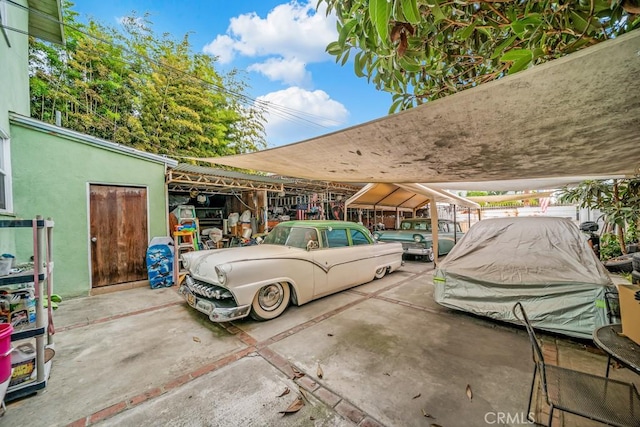 garage featuring a carport