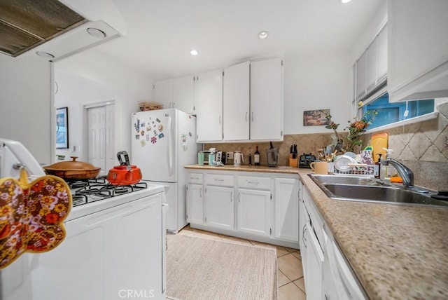 kitchen featuring sink, white appliances, light tile patterned floors, ventilation hood, and white cabinets