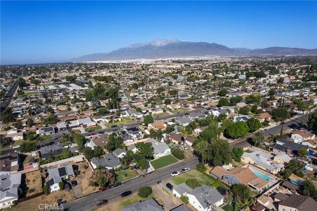 birds eye view of property with a mountain view