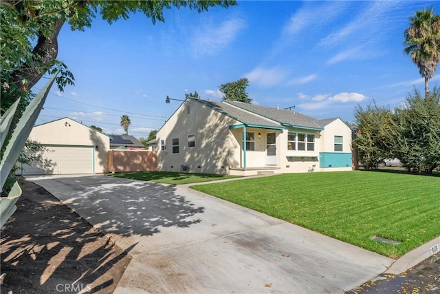 view of front of house with an outbuilding, a garage, and a front yard