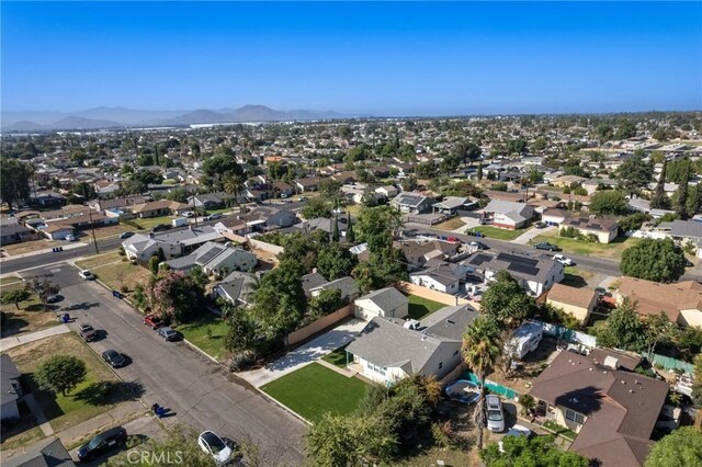 birds eye view of property with a mountain view