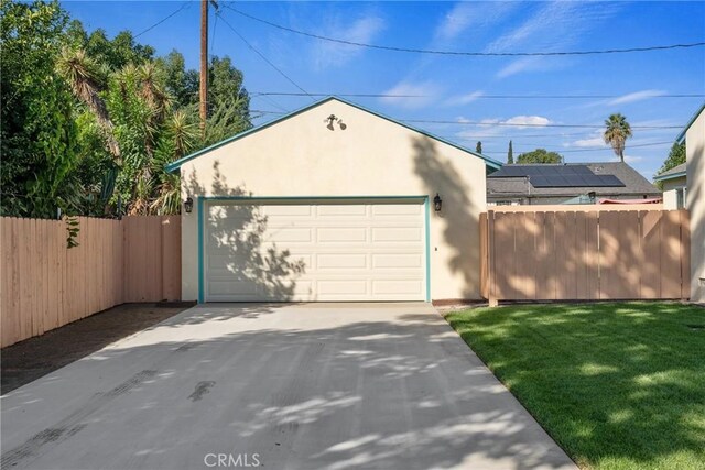 garage featuring a yard