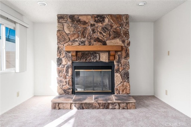 details with carpet flooring, a stone fireplace, and a textured ceiling