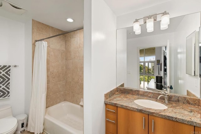 bathroom featuring shower / tub combo, vanity, toilet, and recessed lighting