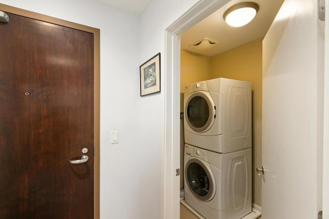 laundry room featuring stacked washer / dryer