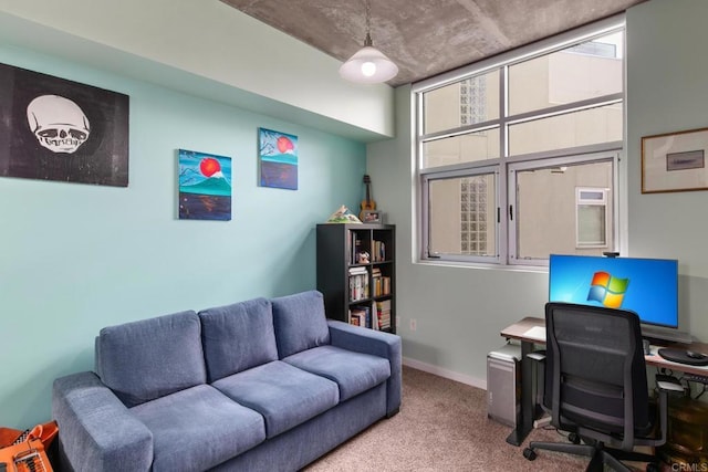 carpeted office space featuring baseboards