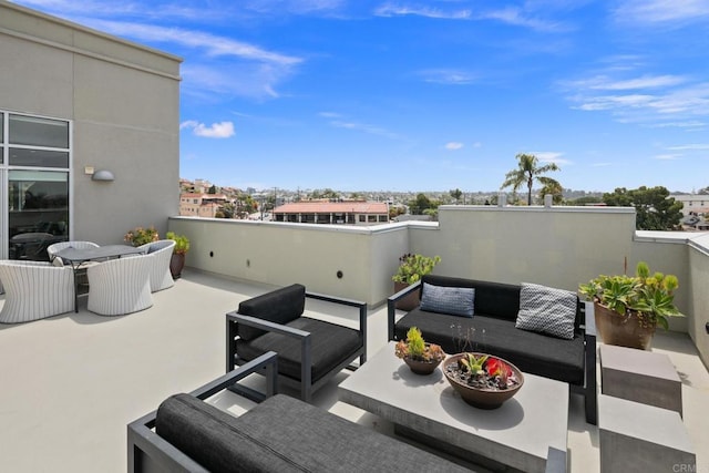 view of patio with outdoor lounge area and a balcony